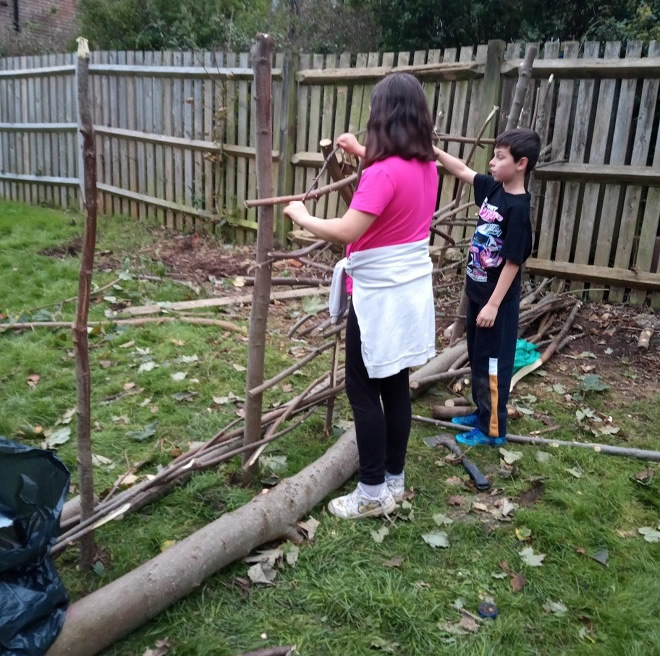 Girl building a fence